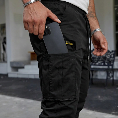 👖50% KORTING🏃 Werkkleding-joggingbroek | Trekkoord in de taille · Duurzaam polyester · Taps toelopende pijpen · Meerdere zakken