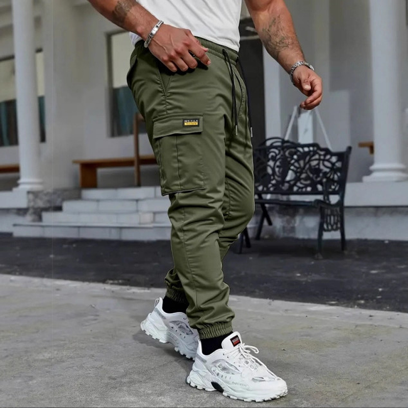 👖50% KORTING🏃 Werkkleding-joggingbroek | Trekkoord in de taille · Duurzaam polyester · Taps toelopende pijpen · Meerdere zakken