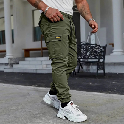 👖50% KORTING🏃 Werkkleding-joggingbroek | Trekkoord in de taille · Duurzaam polyester · Taps toelopende pijpen · Meerdere zakken
